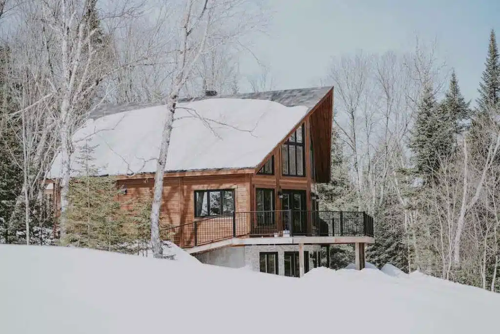 an Ottawa house in winter with lots of snow on the roof