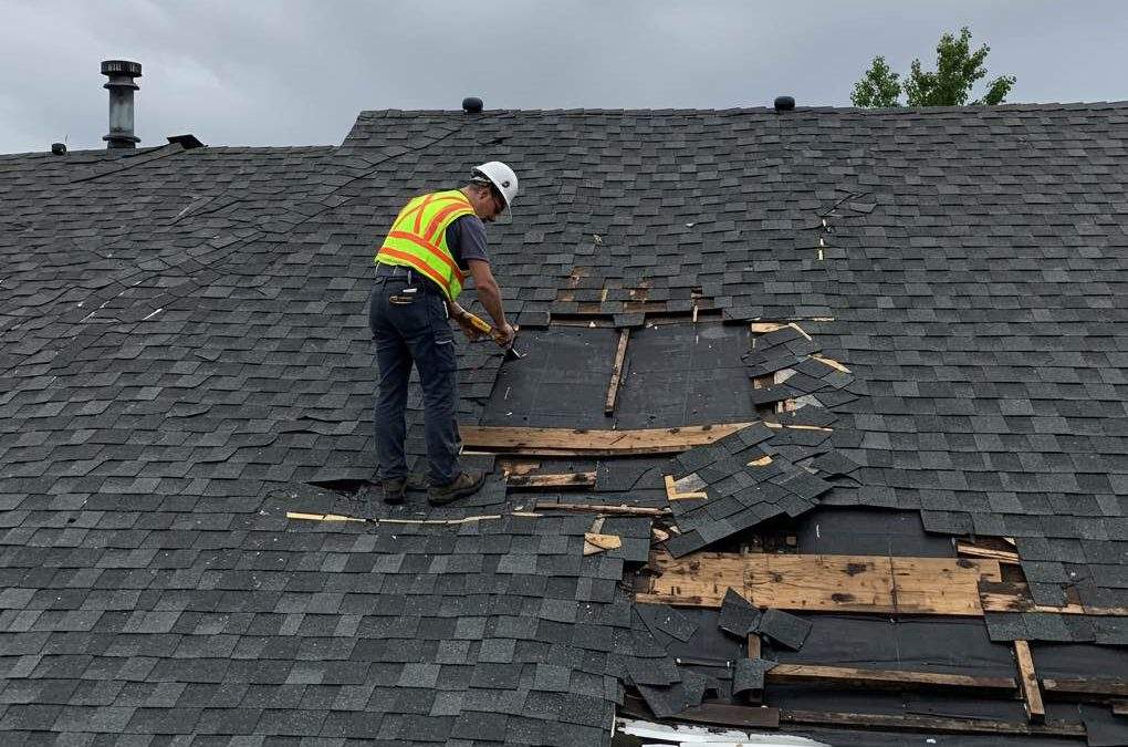 roof damage being inspected after an Ottawa summer storm