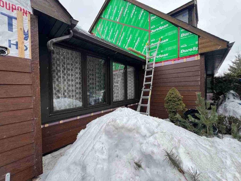 Fibre cement siding installation in-progress by Vanity Roofing in Ottawa