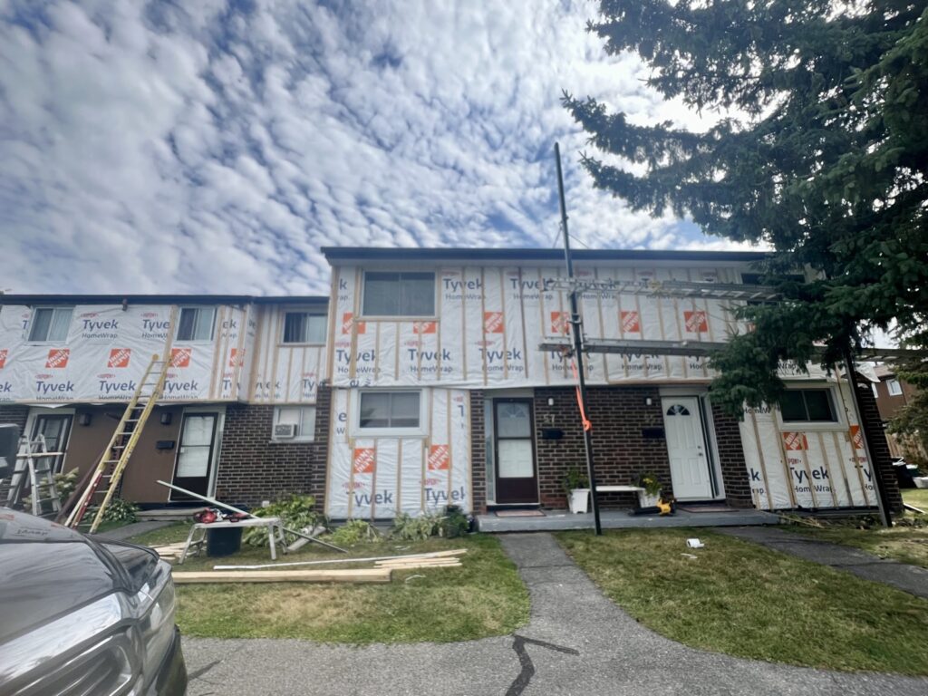 LP SmartSide siding replacement on a townhouse block