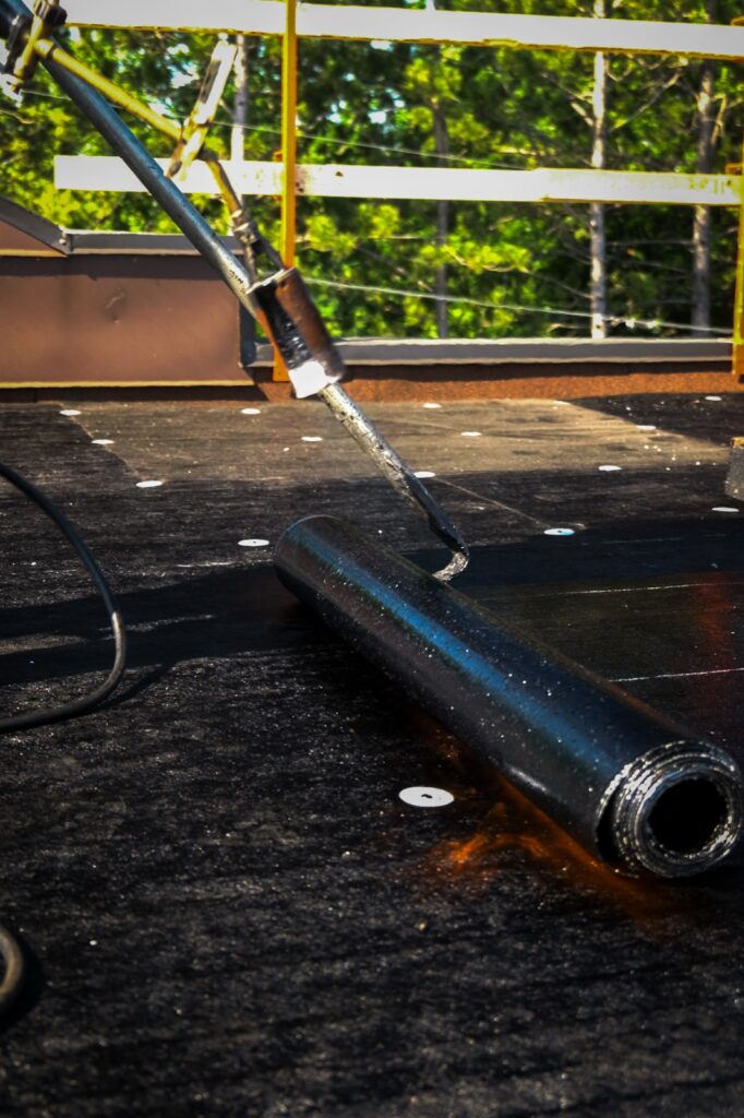 Torching a modified bitumen flat roof in Barrhaven